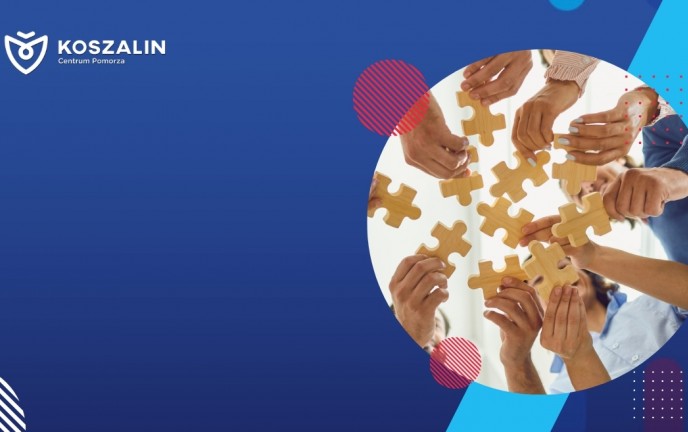 Na grafice znajdują się ludzie dokładający elementy puzzli