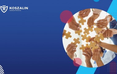 Na grafice znajdują się ludzie dokładający elementy puzzli